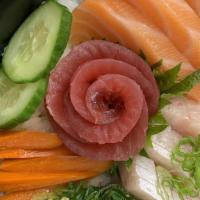 Triple Don · Raw. Tuna, salmon, yellowtail on top of a bowl of rice.
