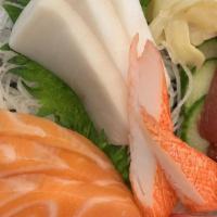 Sashimi Deluxe · Raw. Twelve pieces of sashimi under chef choices.