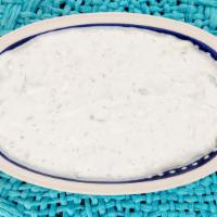 Tzatziki · Homemade strained Greek yogurt with sliced cucumbers, garlic, herbs, vinegar, olive oil. Enj...