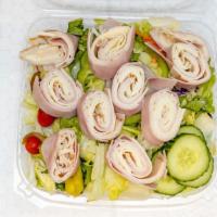 Chef'S Salad · Our fresh, crisp garden salad piled high with ham, turkey, and American cheese served with a...