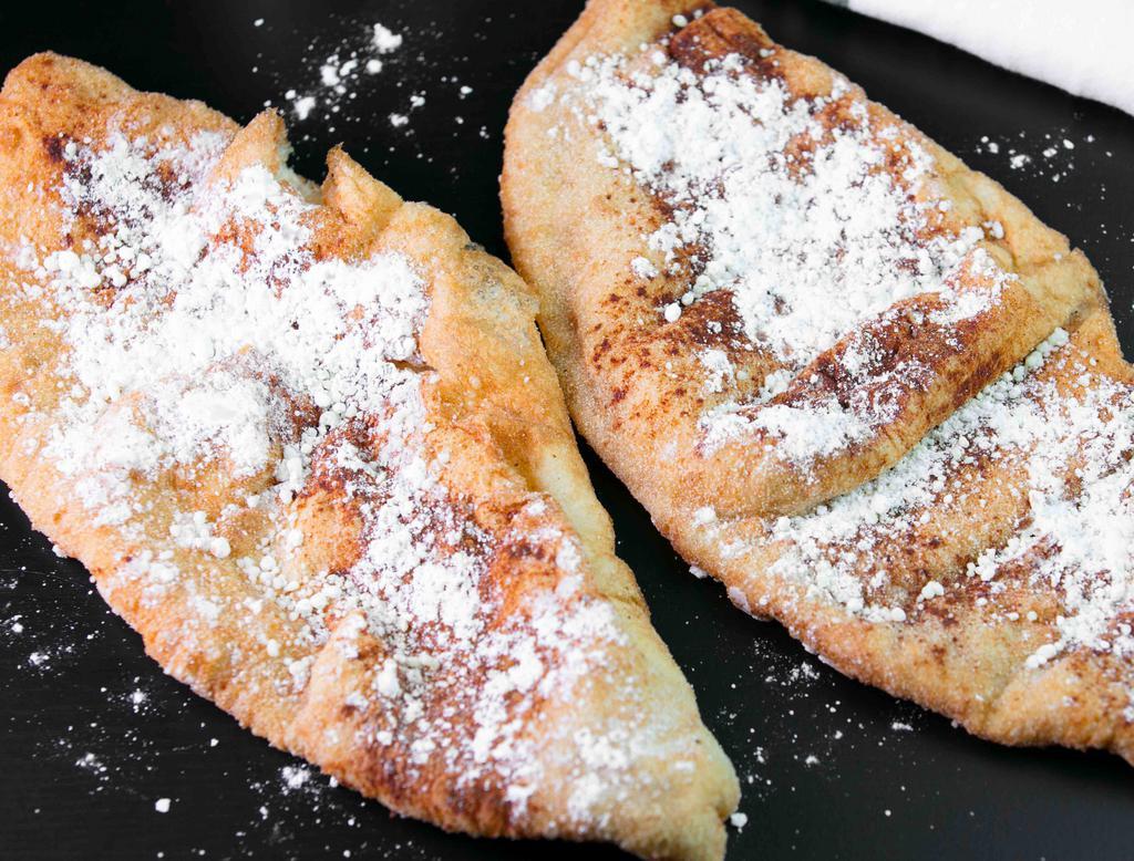 Fried Dough · Fried dough topped with powdered sugar and cinnamon.