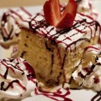 Tres Leches · Sponge cake soaked overnight in three kinds of milk then topped with fresh whipped cream and...