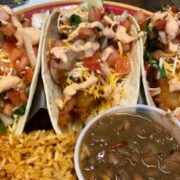 Baja Tacos (3) Fish · Beer battered fish, coleslaw, Monterey jack cheese, pico de gallo, lime and wedge drizzled w...