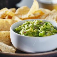 Guacamole & Chips · Smashed avocado, tomato, onion, jalapeno, cilantro, lime, served with fresh tortilla chips.