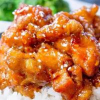 Sesame Chicken · Chunk of chicken Sautéed in special brown sauce with sesame seeds on top and broccoli on the...