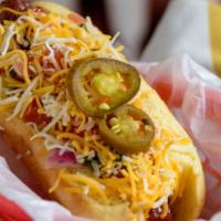 Street Dog · Bacon wrapped all beef hot dog with refried beans topped with mustard, mayo, ketchup, pico d...