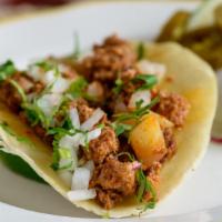 Chorizo & Potato Taco · House made, spicy ground pork and diced potato, corn tortilla, cilantro, onion.  Served with...