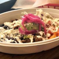 Carne Asada Bowl · Slow roasted beef over red rice with pico de gallo, black beans, pickled red onion, cabbage,...