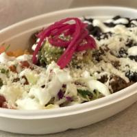 Carnitas Bowl (Pork) · Slow cooked pork over red rice with pico de gallo, black beans, pickled red onion, cabbage, ...