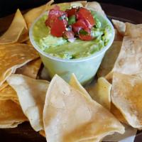 Guac On The Spot · Tortilla chips with freshly-made guacamole