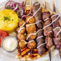 Lamb Kabob · Three char-grilled skewers of lamb, brushed with garlic and spices.