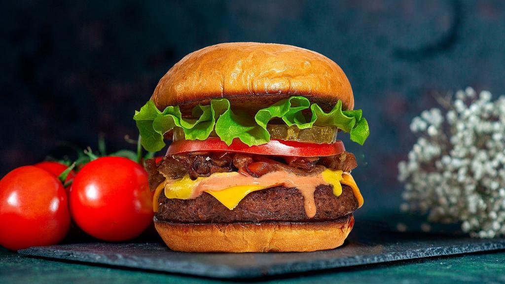 Classic Burger · American beef patty topped with buttered lettuce, tomato, onion, and pickles. Served on a warm bun.