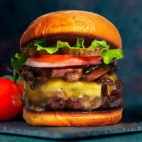 Mushroom & Cheese Burger · American beef patty cooked medium rare and topped with mushrooms, melted cheese, buttered le...
