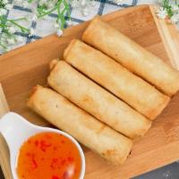 Crispy Veggie Rolls · Four crispy spring rolls filled with carrot, red onion, taro, cabbage served with sweet and ...