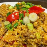 Tum Yum Fried Rice · Hot. Fried rice with tom yum flavor with chili paste, Thai herbs, egg, red pepper, onion, mu...