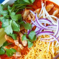 Khao Soi · Northern style curry noodle dish with steamed egg, your choice of meat, red onion and topped...