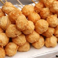 (New) Fried Fish Ball · Made from fish paste and deep-fried. Juicy & chewy on a skewer and served with sweet brown s...