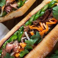 Grilled Steak Sandwich  · Combination of grilled tender juicy slices of steak serve with mayo, vietnamese pickles, cil...