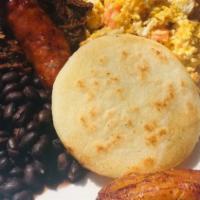 Caracas Brunch · Perico, grilled chorizo, plain arepa, black beans, carne mechada, and sweet plantains.