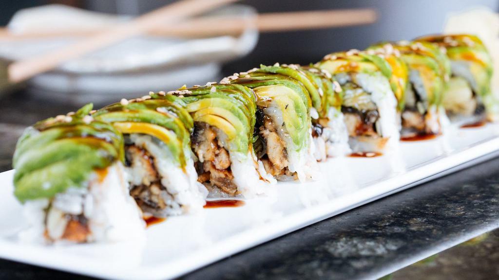 Dragon Roll · Grilled eel and cucumber roll topped with avocado, eel sauce, and sesame seeds.