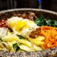 Bibimbap · Sauteed beef, vegetables, fried egg, on top of white rice with a side of  gochujang sauce ( ...