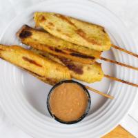 Satay · Grilled chicken on skewers served with peanut sauce.