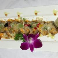Patriots Maki · Tuna, salmon, yellowtail, avocado, cucumber, inside, and topped with torched tuna, salmon, y...