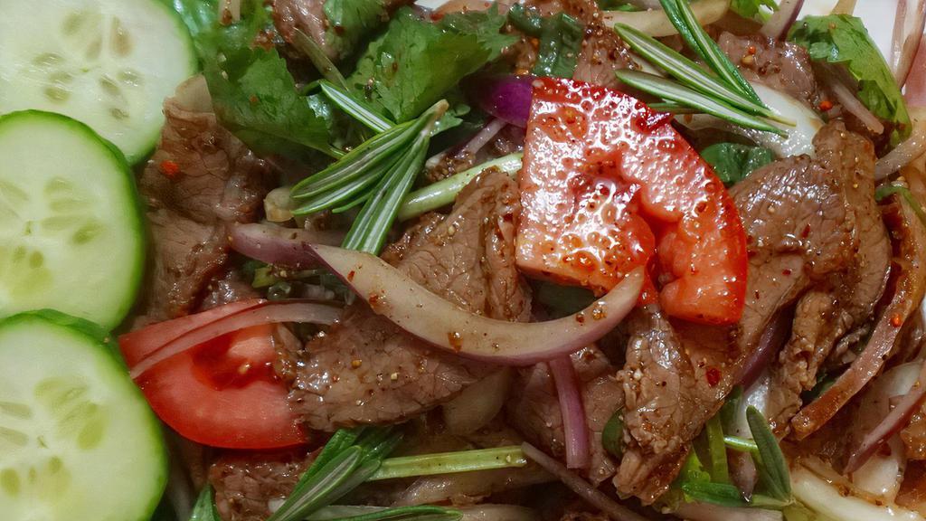 Beef Salad · Spicy. Marinated beef slices with veggies and spicy house salad dressing.