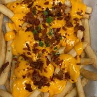 Bacon Cheese Fries · Bacon, Cheese Sauce and Chopped Fresh Parsley.