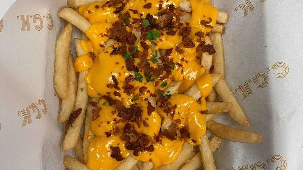 Bacon Cheese Fries · Bacon, Cheese Sauce and Chopped Fresh Parsley.