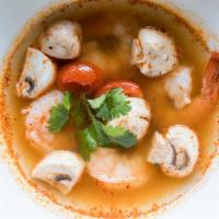 Tom Yum Soup · Thai famous soup spiced with chili, lemongrass, mushroom, tomato, scallions and lime juice.