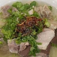 Beef Noodle Soup Sliced Eye Round & Tendon · All noodle soup is served with thinly sliced onion, scallion, cilantro, and with a side of b...