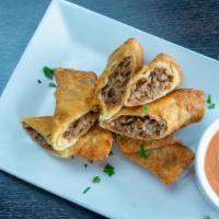 Cheesesteak Egg Rolls · With spicy ketchup.