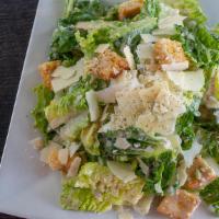Side Caesar Salad · Crisp romaine lettuce with croutons, parmesan cheese and caesar dressing.