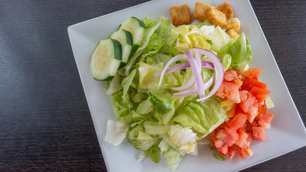 Side Garden Salad · Fresh mixed greens with tomatoes, red onions, and cucumbers  with your choice of dressing.