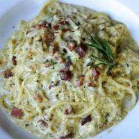 Carbonara · Pancetta, onions, egg yolk, parmesan, homemade pasta selection, light pesto cream sauce.