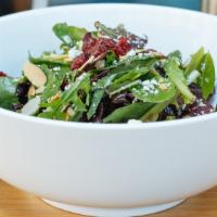 Baby Greens · Baby mixed greens, sun-dried cranberries, sliced almonds, raspberry vinaigrette and blue che...