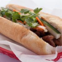 Grilled Pork Sandwich / Banh Mi Thit Heo · Seasoned grilled pork laced with sauces and herbs In addition to the condiments above.
