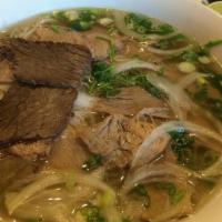 Well Done Beef Pho / Pho Chinh · Noodle soup with thin sliced well done top rounds (that were cooked along in the making of p...