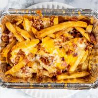 Bacon Cheese Fries · Yellow cheese, steak fries, and bacon.