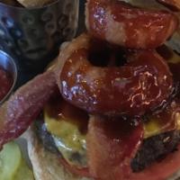Southern · Topped with bbq sauce, crispy bacon, cheddar cheese, two onion rings & lto.