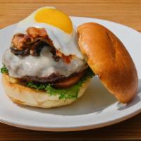 Umami · Topped with mushrooms, provolone cheese, bacon, fried egg, roasted garlic aioli, lettuce & t...