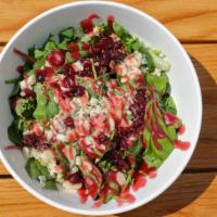 Baby Greens · Baby mixed greens, sun-dried cranberries, sliced almonds, raspberry vinaigrette & blue chees...
