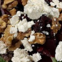 Roasted Beets & Goat Cheese Salad · Baby spinach, beets, onions, cucumbers, walnuts, sun-dried cranberries, and goat cheese.