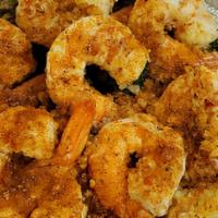 Broiled Shrimps · Served with rice and broccoli with garlic butter sauce and old bay season.