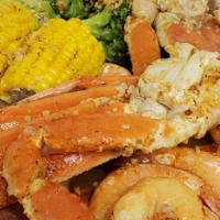 Snow Crab With Shrimps · 2 crust snow crab served with corn, broccoli, potato with garlic butter sauce and old bay se...