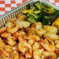 Steamed Shrimps · 1 lb shrimp served with corn, broccoli, potato with garlic butter sauce and old bay season.