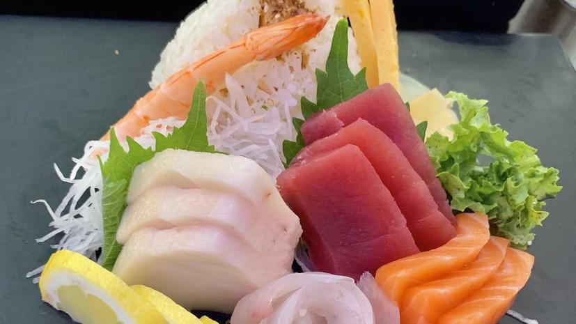 Chirashi Sushi · Fifteen pieces of assorted fresh raw fish over sushi rice. Served with soup and salad.