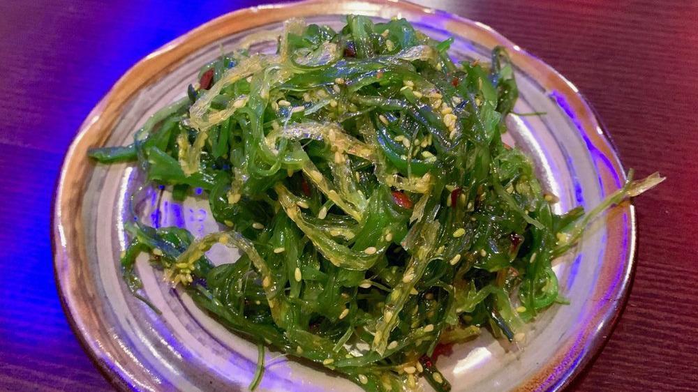 Seaweed Salad · Green seaweed with sesame seeds.