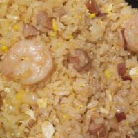 Cajun Fried Rice · Shrimp, sausage, egg and corn sautéed in Cajun garlic butter seasoning.